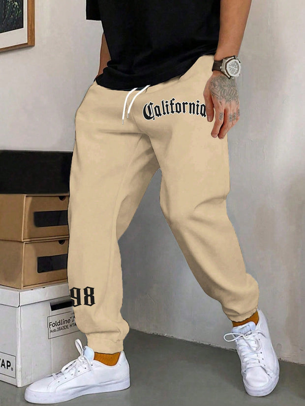 Men Apparel, Men Bottoms, Men Clothing, Men SweatpantsManfinity Men Letter Graphic Drawstring Waist Sweatpants - Premium  from Nobles Store - Just $41.90! Shop now at Nobles Store