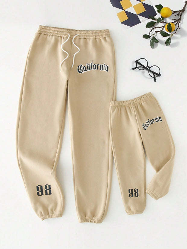 Men Apparel, Men Bottoms, Men Clothing, Men SweatpantsManfinity Men Letter Graphic Drawstring Waist Sweatpants - Premium  from Nobles Store - Just $41.90! Shop now at Nobles Store